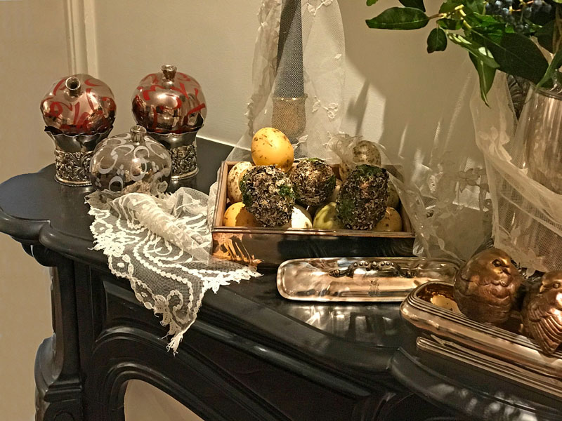 metallic-silver ceramic pomegranates and decorated eggs