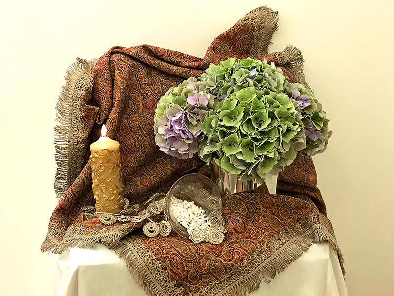 bouquet of hydrangeas, candle, silver thread trim