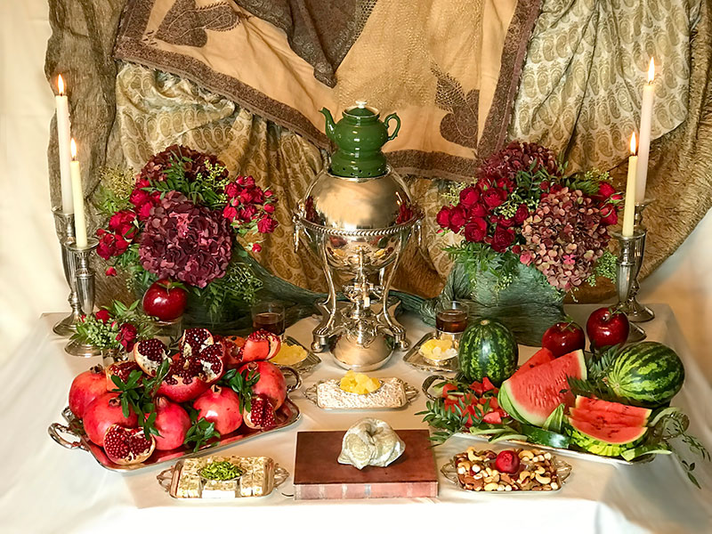 samovar, antique teapot, dried fruit & nuts, sweets, fresh red fruits, flowers, flames & verse