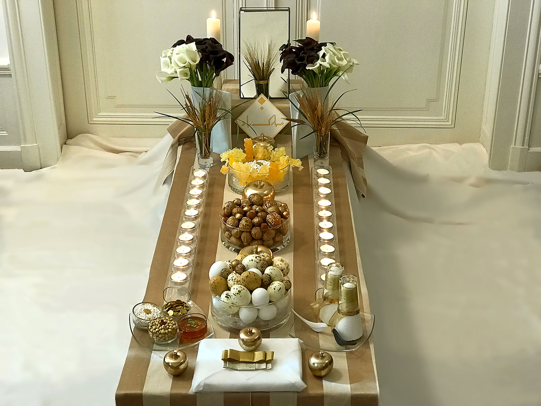marriage sofreh with gold and glass, candles, eggs