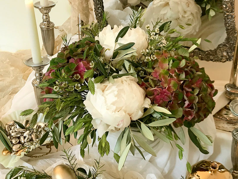 smoked red/pink/green hydrangeas, ivory peonies, wax flower and fine, graceful foliage