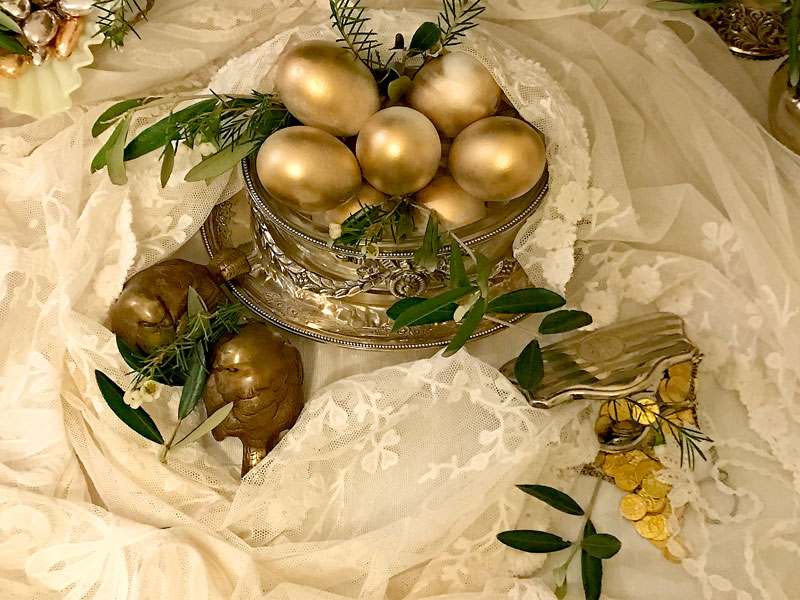 gold-finish eggs presented in a crystal and silver-plated antique vessel