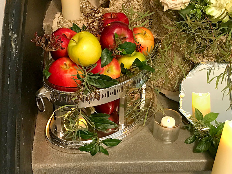 apples in silver-plated container