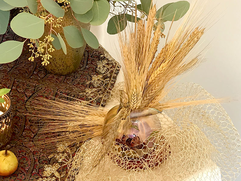 sheaves of wheat in antique vase, with mesh