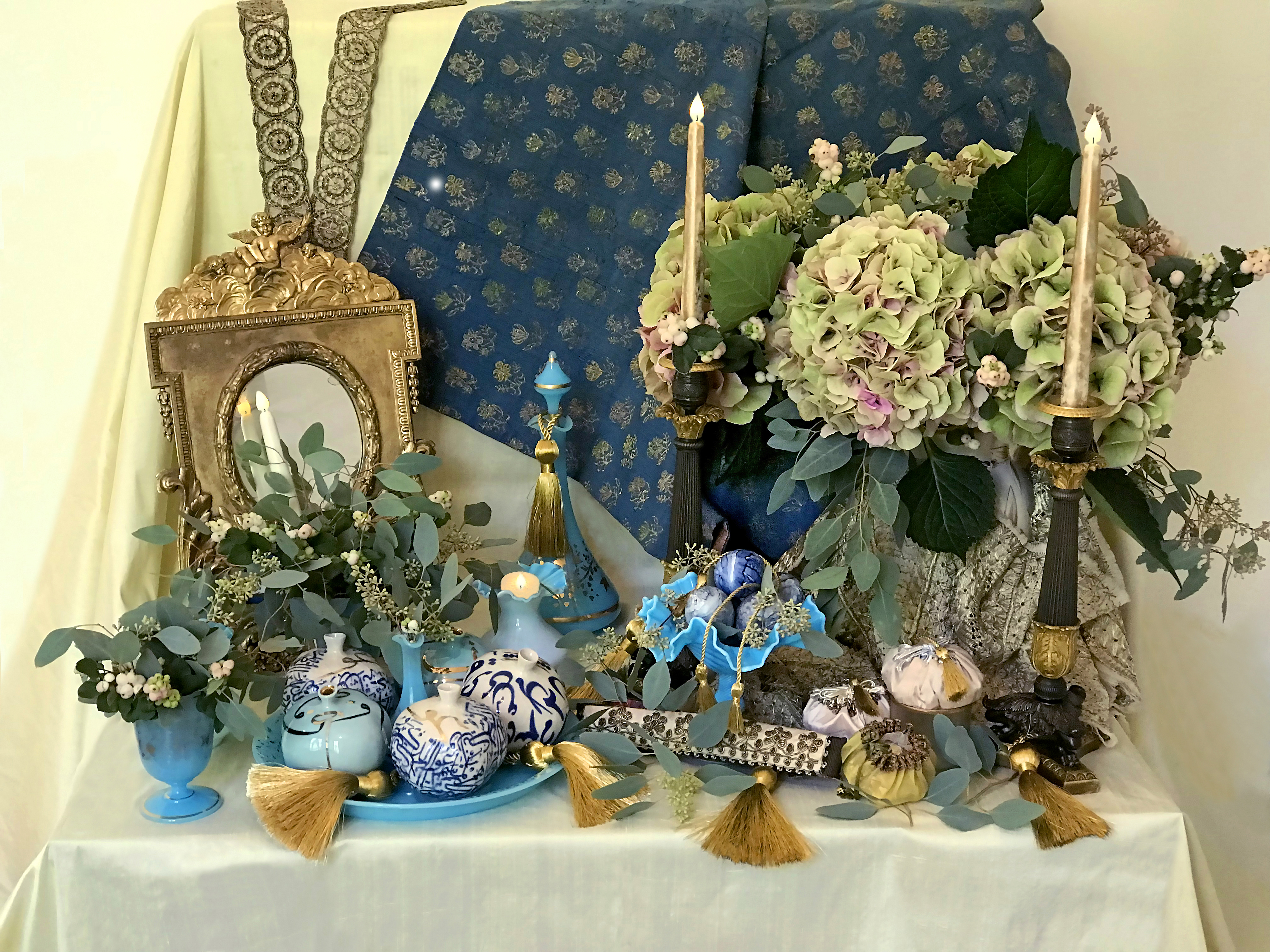 mirror, candelabra, pomegranates, decorated eggs, flasks of rosewater and handmade bonbonnières