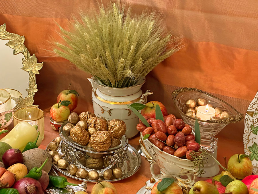 an antique porcelain vase holding an ample sheaf of wheat