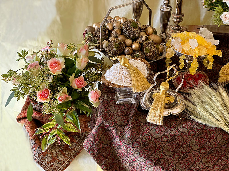 baskets of decorated eggs, gilded coins, almonds, crystal sugar, and foliage baskets of decorated eggs, gilded coins, almonds, crystal sugar, and foliage