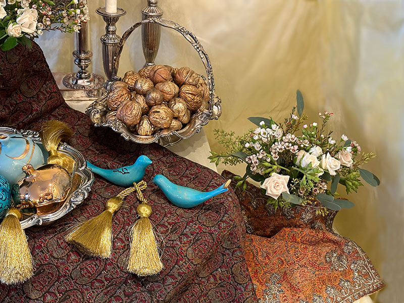 antique silver-plated basket with gold nuts, ceramic birds, and flowers antique silver-plated basket with gold nuts, ceramic birds, and flowers